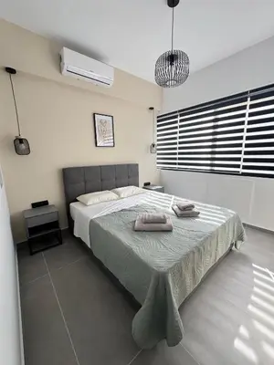 a bedroom with a bed with two towels on it at Heart of Athens Stay #6 in Athens