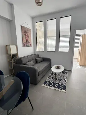 a living room with a couch and a table at Heart of Athens Stay #6 in Athens