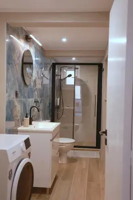 a bathroom with a shower and a toilet and a sink at Heart of Athens Stay #6 in Athens