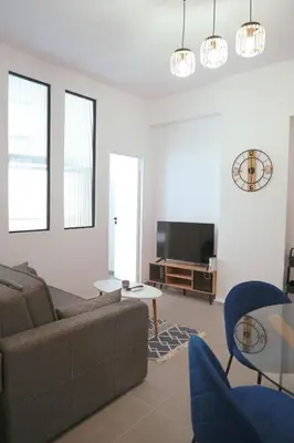 a living room with a couch and a tv at Heart of Athens Stay #6 in Athens