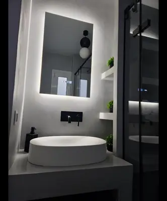 a bathroom with a white sink and a mirror at Sourmel Apt in Athens