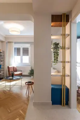 a living room with a couch and a table at Immaculate Modern Kypseli Apt - Next to Kanari Sq in Athens