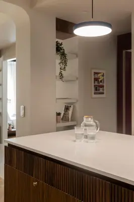 a kitchen with a white counter top in a room at Immaculate Modern Kypseli Apt - Next to Kanari Sq in Athens