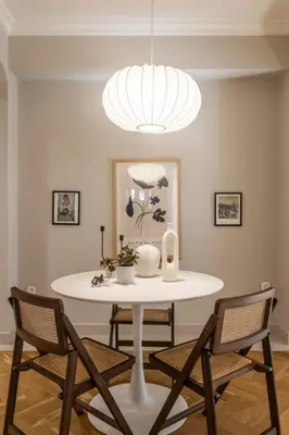 a dining room with a white table and chairs at Immaculate Modern Kypseli Apt - Next to Kanari Sq in Athens