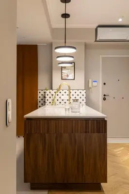 a kitchen with a island with a white counter top at Immaculate Modern Kypseli Apt - Next to Kanari Sq in Athens
