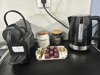 a black table with a coffee maker and a coffee pot at Heart of Athens Luxury 2BR#8 in Athens