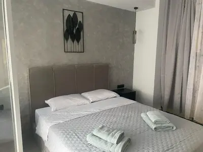a bedroom with a bed with two towels on it at Heart of Athens Luxury 2BR#8 in Athens
