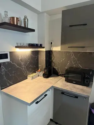 a kitchen with a counter top with a microwave at Heart of Athens Luxury 2BR#8 in Athens