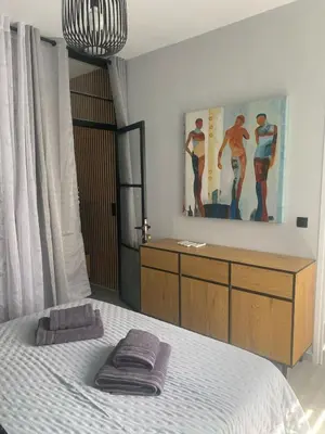 a bedroom with a bed and a painting on the wall at Heart of Athens Luxury 2BR#8 in Athens