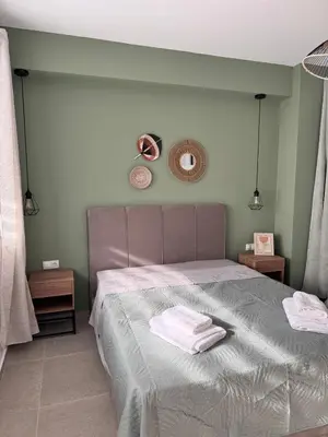 a bedroom with a bed with two towels on it at Athens Soul stay#7 in Athens