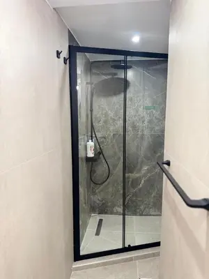 a shower with a glass door in a bathroom at Athens Soul stay#7 in Athens