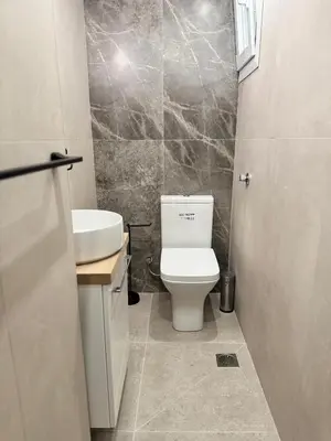 a bathroom with a toilet and a sink at Athens Soul stay#7 in Athens