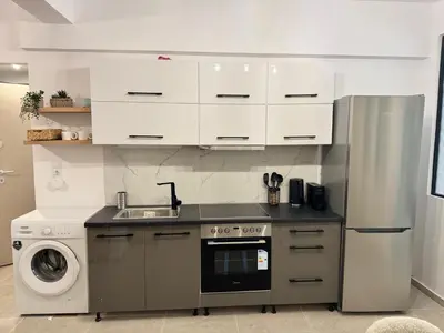 a kitchen with a sink and a refrigerator at Athens Soul stay#7 in Athens