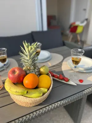 a bowl of fruit sitting on a table at AK Athens Fine Stay - Penthouse with Big Terrace and View - 2 min from Metro in Athens