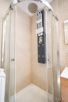 a shower with a glass door in a bathroom at Breezy Maisonette in Zea for 5 by Filos Inc in Piraeus