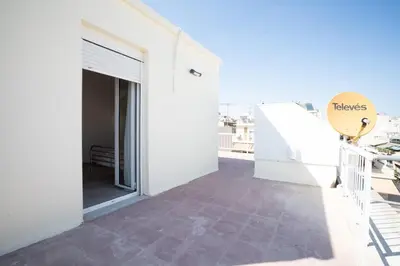 a balcony with a view of a building at Breezy Maisonette in Zea for 5 by Filos Inc in Piraeus