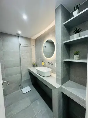a bathroom with a sink and a shower and a mirror at Downtown Lux apartment in Athens