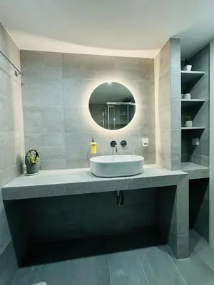 a bathroom with a sink and a mirror at Downtown Lux apartment in Athens