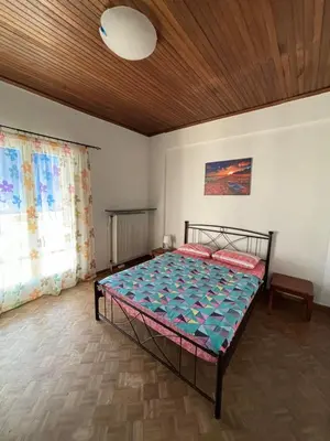 a bedroom with a bed in a room at Onix 4 in Athens