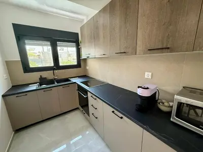 a kitchen with a sink and a counter top at Comfort SpataAir Stay in Spáta