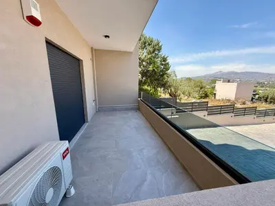 a balcony of a house with a swimming pool at Comfort SpataAir Stay in Spáta