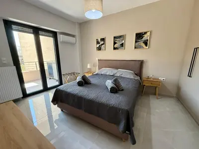 a bedroom with a bed with two pillows on it at Comfort SpataAir Stay in Spáta
