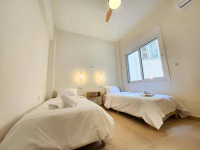 two beds in a room with a window at Prestige in Athens