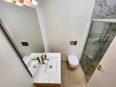 a bathroom with a sink and a shower and a toilet at Prestige in Athens