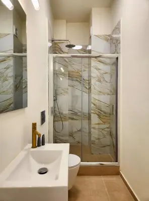 a bathroom with a shower and a toilet and a sink at Prestige in Athens