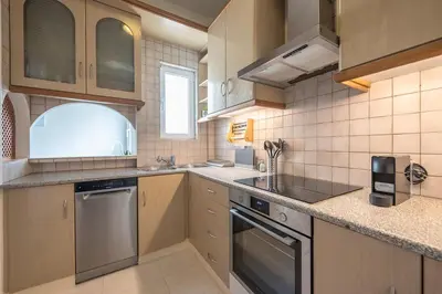 a kitchen with a sink and a dishwasher at Lycabettus View Top Floor 2BdApt in Athens