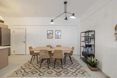 a kitchen and dining room with a table and chairs at Cozy 3 bdr Apartment next to Acropolis in Athens