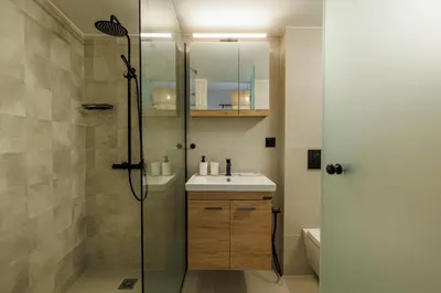 a bathroom with a shower and a sink at Cozy 3 bdr Apartment next to Acropolis in Athens
