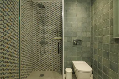 a bathroom with a shower with a toilet in it at Cozy 3 bdr Apartment next to Acropolis in Athens