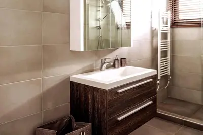 a bathroom with a sink and a mirror at Cyan Villa in Anavissos