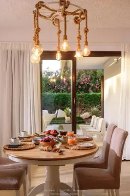 a table with food on it in a living room at Cyan Villa in Anavissos