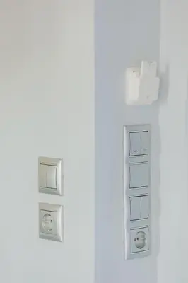 a white room with two electrical outlets on a wall at Paradise Heated Jacuzzi with Acropolis View in Athens