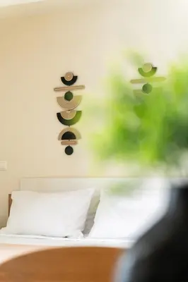a bedroom with a bed with two sandals on the wall at Elysee apartment 7 in Athens