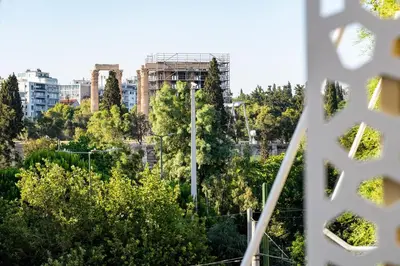 a view of a city with trees and buildings at Central Athens Spacious Boho Retreat In Acropolis in Athens