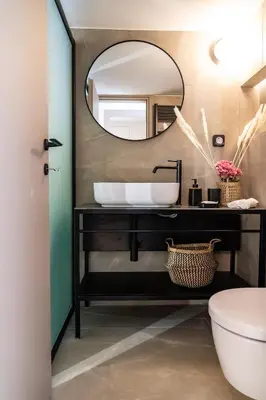 a bathroom with a sink and a mirror at Central Athens Spacious Boho Retreat In Acropolis in Athens