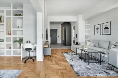 a living room with a white couch and a table at Astoria - Luxury 2-BR Apartment in Athens in Athens