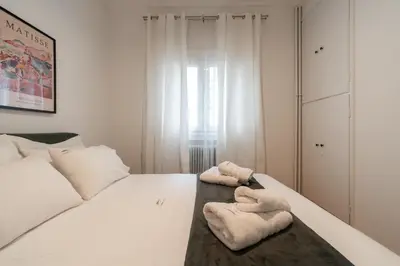 a bedroom with two towels on a bed at Artistic Elegance in central Athens, Pangrati in Athens