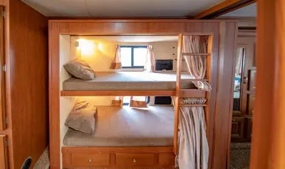 a couple of bunk beds in a small room at Athens Motorhome Park GEORGETOWN RV in Yialoú