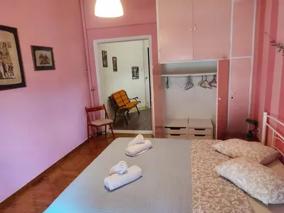 a bedroom with two towels on a bed at No7 Theo Homeybee Exarcheia in Athens