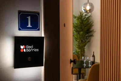 a door to a room with a red benefits sign on it at Kaf23 - 2BR apt with Balcony in Athens