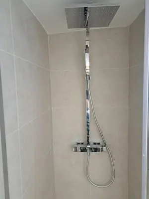 a shower with a shower head in a bathroom at Exarchia Penthouse Cozy & Central in Athens