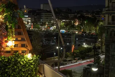 a view of a city at night with traffic at Serenity Luxury Estates in Piraeus