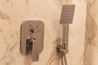 a shower with a soap dispenser in a bathroom at Serenity Luxury Estates in Piraeus