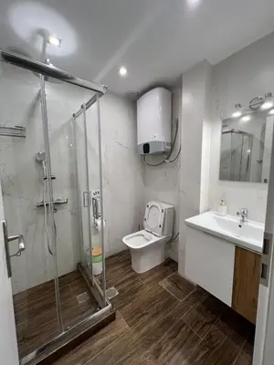 a bathroom with a shower and a toilet and a sink at Athens Hotspot Residence in Athens