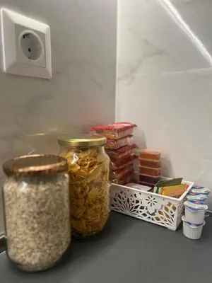 two jars of food sitting on a shelf in a refrigerator at Athens Hotspot Residence in Athens