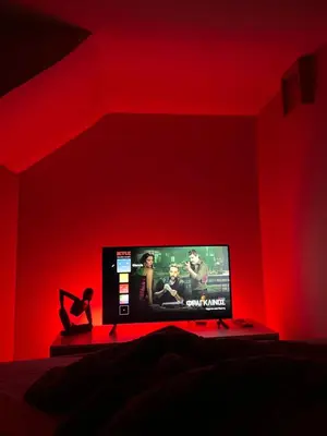 a bedroom with a tv in a red room at Athens Hotspot Residence in Athens
